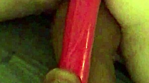 Older woman gets her pussy and ass fucked with a huge dildo in homemade video