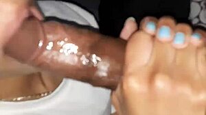 A young and attractive African American woman successfully takes on a large penis, demonstrating her skills in deepthroating and handling a big load.